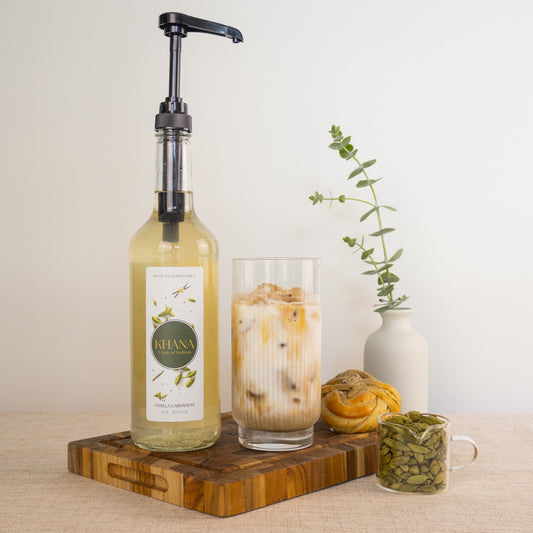 Khana Vanilla Cardamom syrup lifestyle - iced latte with syrup pump