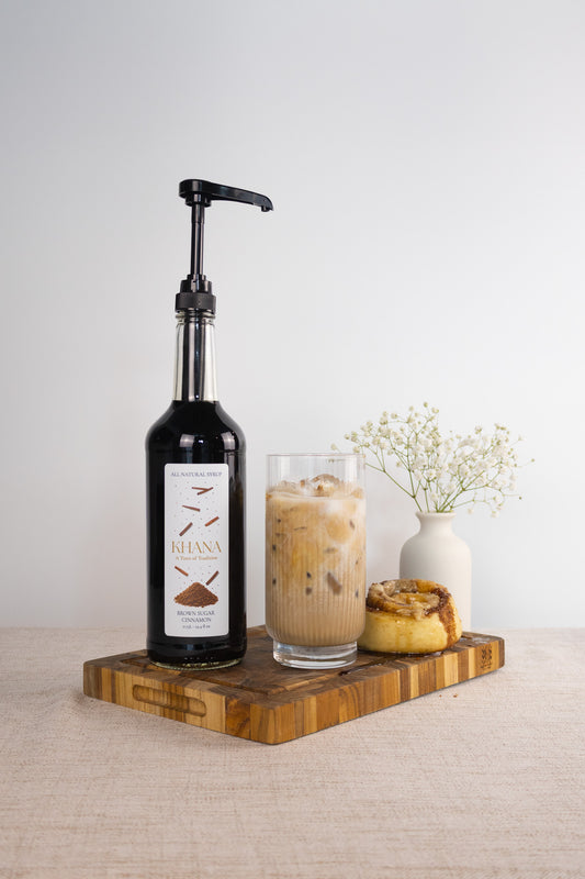 Khana Brown Sugar Cinnamon Syrup lifestyle shot - warm spiced all-natural coffee and matcha syrup