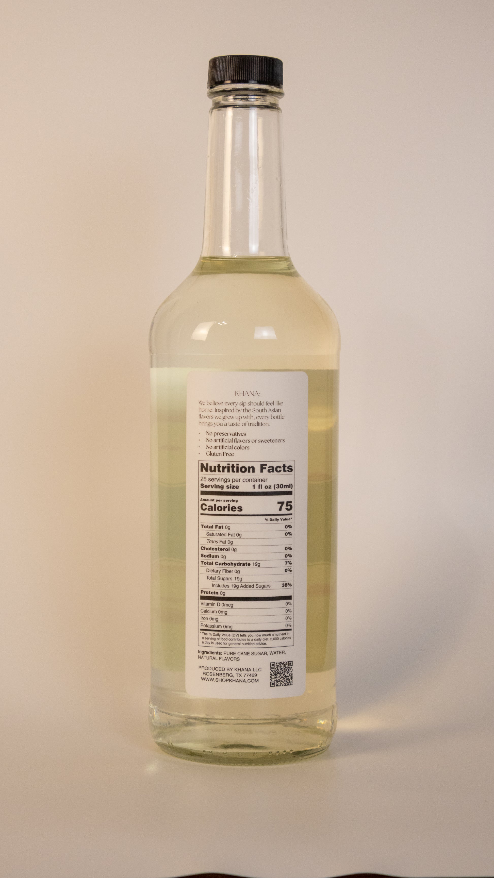 Khana Rose Syrup 750mL nutrition label and ingredients. 25 servings per container. 1oz serving size. 75 calories and 19g of sugar per serving. All natural, no artificial dyes, sweeteners, or flavors of any kind.