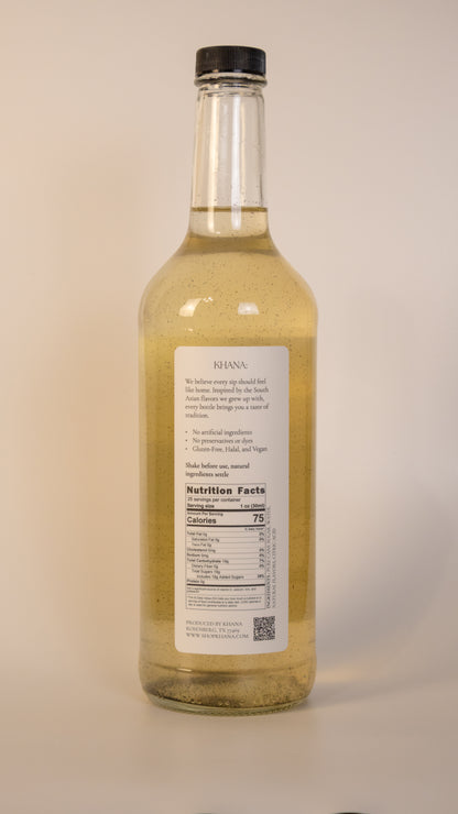 Khana Vanilla Cardamom Syrup 750mL nutrition label and ingredients. 25 servings per container. Serving size is 1oz. 75 calories and 19g of sugar per serving. All natural, no artificial dyes, sweeteners, or flavors of any kind. 